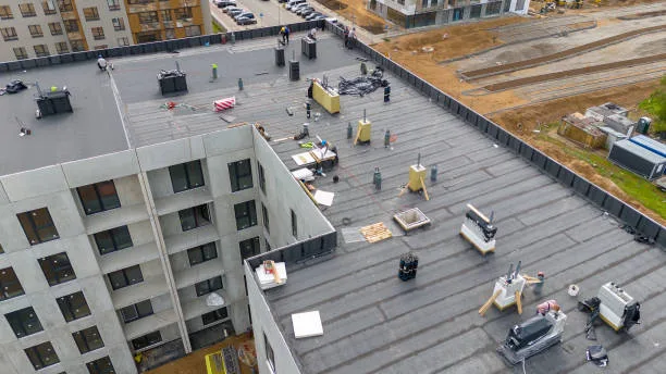 Aerial view of a commercial flat roof with rooftop equipment